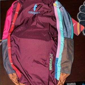 Cotopaxi Batac 24L with teal, pink & maroon accents